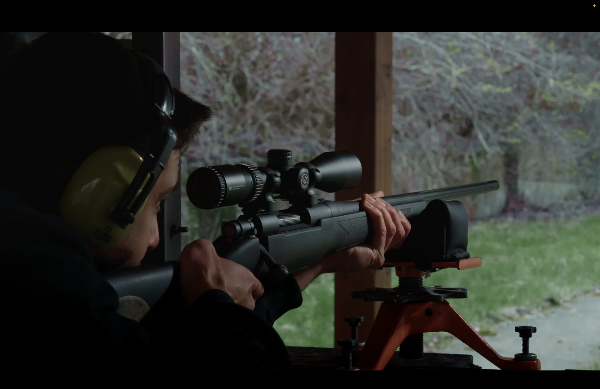 Sniper rifle with scope aimed at the 100 meter target at the shooting range near Sofia